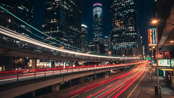 City at Night with Light Streaks and Skyscrapers