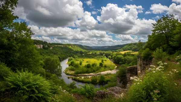 Green Valley River Bends Under a Sky Full of Clouds