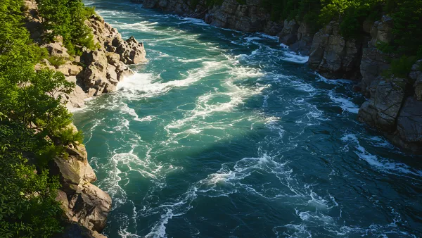 Turquoise River Rapids Carving Through Rocky Terrain