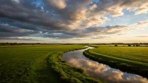 Golden Hour Glow Over Serene River and Lush Green Fields