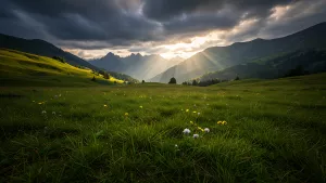 Sun Rays Bursting Through Clouds Over Lush Green Valley