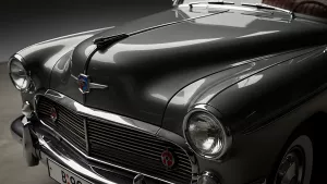 Sleek Gray Classic Car Front Grill and Headlight Detail